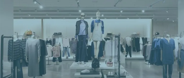 Mannequins and clothing racks in a retail store