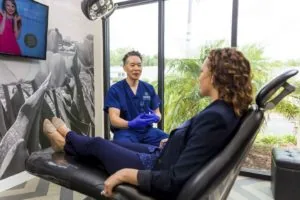 A dentist consulting with a dental patient