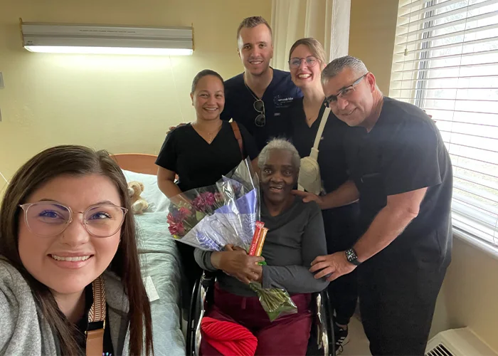 Orange Park team visiting Mrs. Dorthy in the hospital